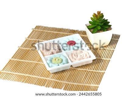 Coconut jelly dessert and cake jelly put on bamboo mat put on white background with isolated picture.