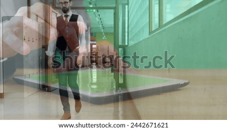 Image of hands of man using tablet, over businessman walking in workplace corridor. business and communication technology concept digitally generated image.