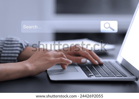 Search bar of website over laptop. Woman using computer at black table, closeup