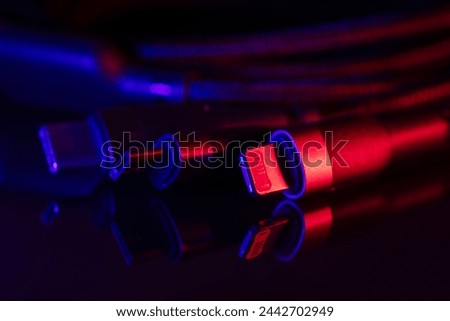 Different USB charging plugs on dark background. USB Type C, Micro USB, Usb lightning.