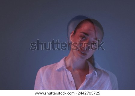 Portrait of beautiful young woman on color background, long-exposure photography. Space for text