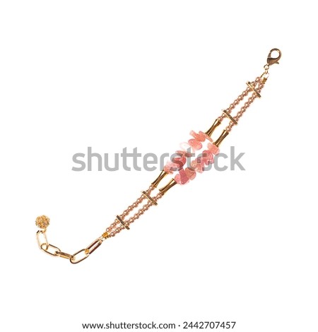 Jewelry bracelet with pearl, gold and semiprecious stones isolated on white background Royalty-Free Stock Photo #2442707457