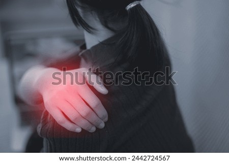 Tired woman massaging rubbing stiff sore neck tensed muscles fatigued from computer work in incorrect posture feeling hurt joint shoulder back pain ache, fibromyalgia concept, close up rear view Royalty-Free Stock Photo #2442724567