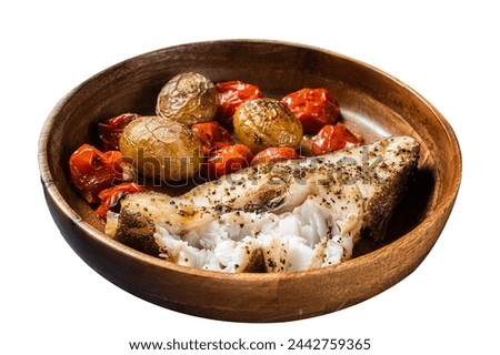 Baked halibut fish with roasted tomato and potato in wooden plate.  Isolated on white background. Top view