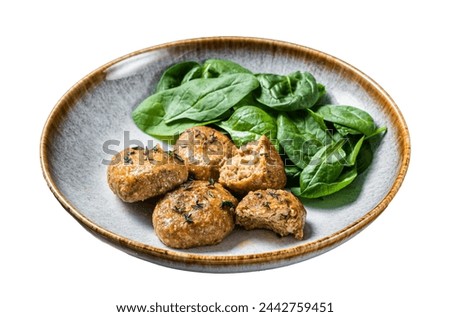 Fish Cakes or Fish balls with tuna and spinach in a plate.  Isolated on white background. Top view