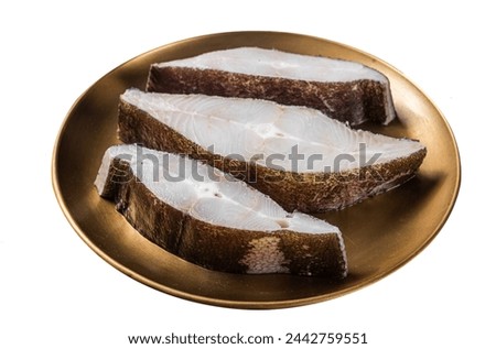 Sliced halibut fish, raw steaks on plate with thyme.  Isolated on white background. Top view