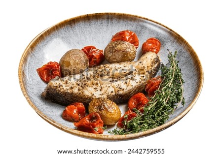 Grilled halibut fish steaks with tomato and potato in plate.  Isolated on white background. Top view