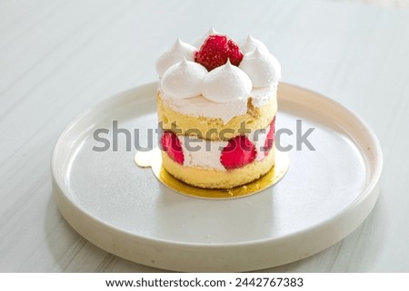 Strawberry short cake on white wooden table 