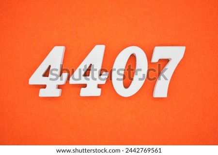 Orange felt is the background. The numbers 4407 are made from white painted wood.