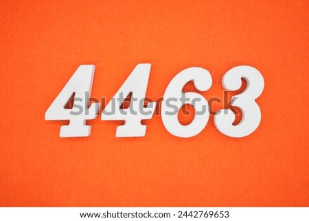 Orange felt is the background. The numbers 4463 are made from white painted wood.