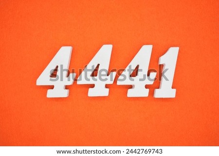Orange felt is the background. The numbers 4441 are made from white painted wood.