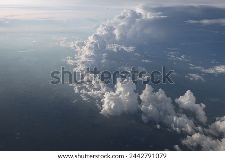 Exterior photo visual view of large cloudscape cloud clouds like cumulus cumulonimbus in the sky white nice ffluffy cotton resh wether view from aerial altitude Royalty-Free Stock Photo #2442791079