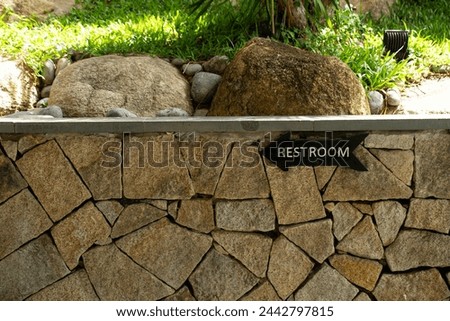 Outdoor 'RESTROOM' sign , outdoor toilet