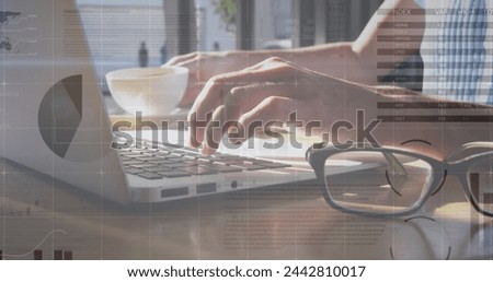 Image of statistics and data processing over man using laptop. global business, digital interface and technology concept digitally generated image