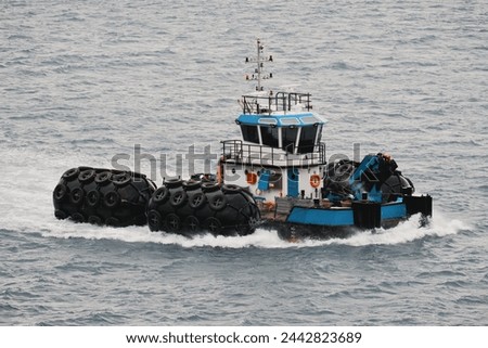 Pneumatic Fender Transportation For Safety During Ship-To-Ship O Royalty-Free Stock Photo #2442823689