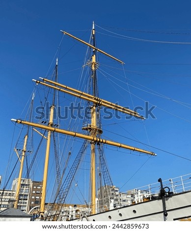 Beautiful old vintage ship masts and blue sky in the city