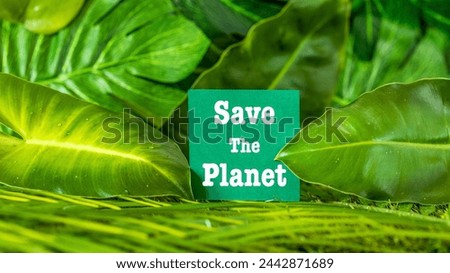 Save the planet. Earth Day concept 3D background. Ecology concept. Design with a white note on a sticky note and natural leaves in the background
