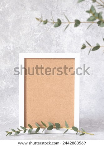 Blank photo frame and flowers hellebores. Floral background. copy space. Vertical photo