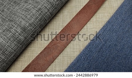 Fabric samples and measuring , close-up. Textile industry