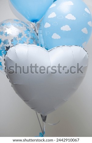 white heart foil balloon on white background