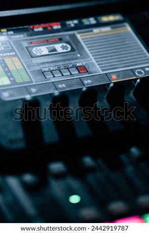 Close up view of digital mixing console in the dark. Luminous buttons, controls and display Royalty-Free Stock Photo #2442919787
