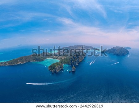 Landscape Nui beach with speed boat in koh Phi Phi Don island, in Krabi, Thailand, sunny day. Aerial drone photo of travel Thai.