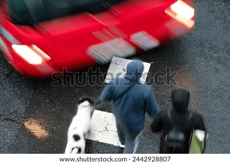 people pedestrian  in dangerous situation in crosswalk in city street by vehicles at high speed