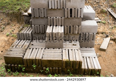 Selected focus photo of a pile of bricks in the yard