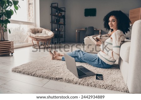 Photo portrait of attractive young woman sit floor write notebook dressed casual clothes cozy day light home interior living room