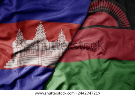 big waving national colorful flag of malawi and national flag of cambodia. macro
