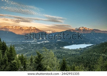 Spectacular view of Whistler and Blackcomb mountains and valley at sunset Royalty-Free Stock Photo #2442951335