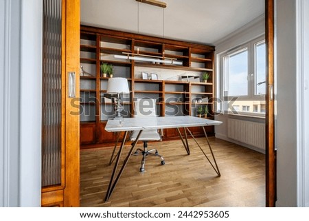 Vintage office library interior design with marble desk and stylish lamp