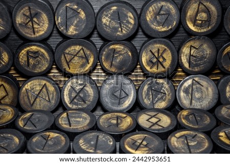 Runes carved from wood on the vintage wood background, Anglo-Saxons Futhark Royalty-Free Stock Photo #2442953651