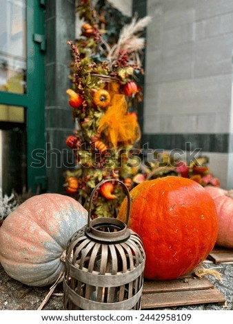 Autumn still life with pumpkins and lanterns in a rustic style
