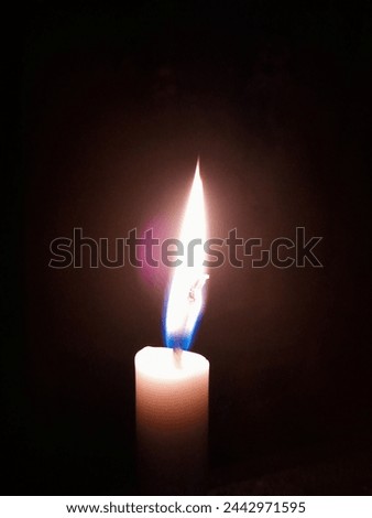 Picture of Candles burn at night.