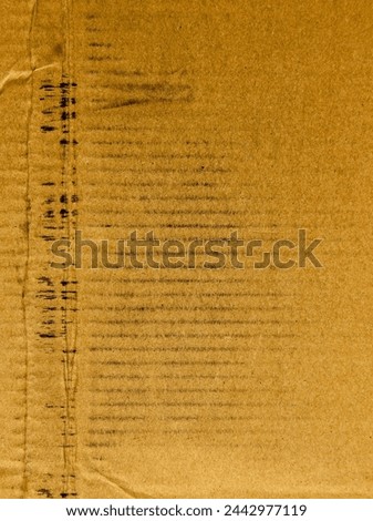 a photography of a piece of paper with a writing pattern on it.