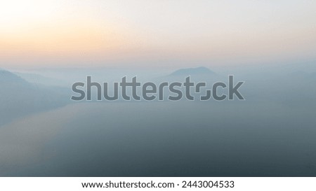 Lake panorama in a foggy morning. aerial view for backgrounds.