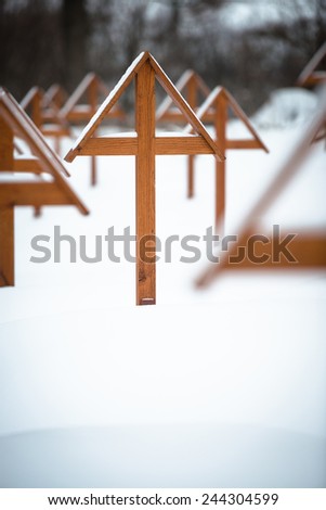 Wooden crosses on military cemetery from WWI in winter