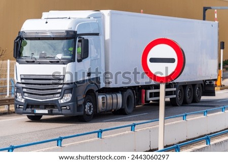 Refrigerated truck passing through a border.