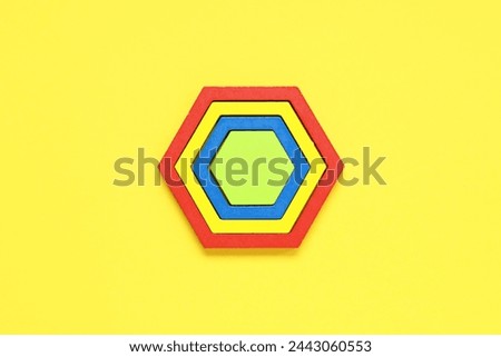 Children toys on yellow background. Concept of autistic disorder