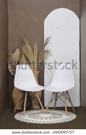 Photo studio with professional equipment and home interior on brown wall background 