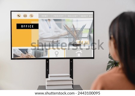 Business woman using website on digital laptop on desk.