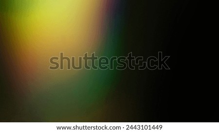 rainbow yellow light overlay refraction texture diagonal natural holographic on black background.