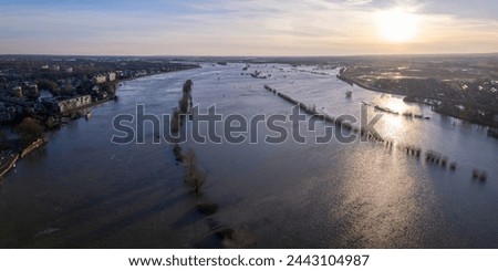 Panorama aerial showing extreme high water level of river IJssel in Zutphen, The Netherlands with inundated floodplains and waterway out of its normal flow riverbanks Royalty-Free Stock Photo #2443104987