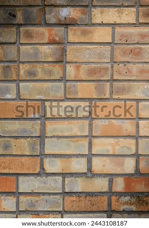 High resolution texture of a yellow brick wall. Laying horizonta