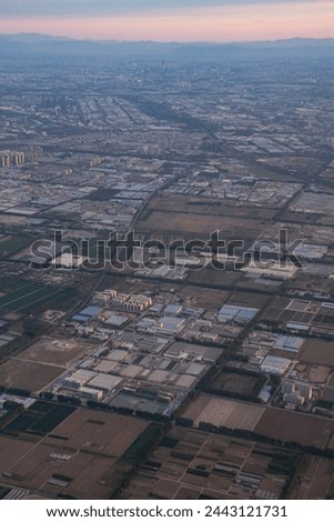 During the flight and before landing at the airport of Beijing city, the scenery around the city of the capital of China, Beijing