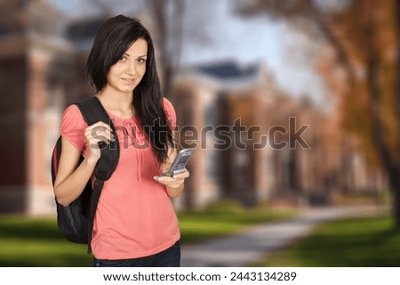 Positive young woman student outdoor
