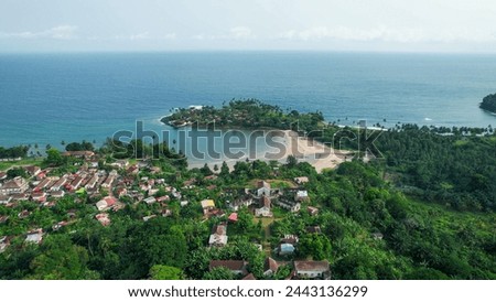 Panoramic drone shot overlooking the Roça Agua Izé town, in Sao Tome and Principe,Africa Royalty-Free Stock Photo #2443136299