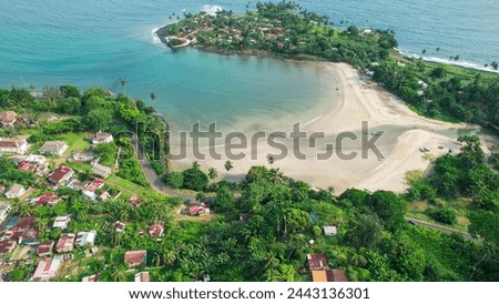 Panoramic drone shot overlooking the Roça Agua Izé town, in Sao Tome and Principe,Africa Royalty-Free Stock Photo #2443136301