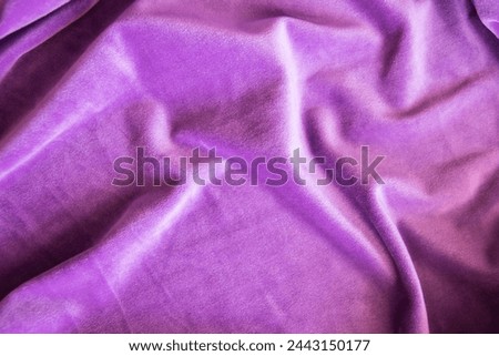 Lilac knitted texture fabric. Purple textile cloth background. Soft material for fashion clothes.